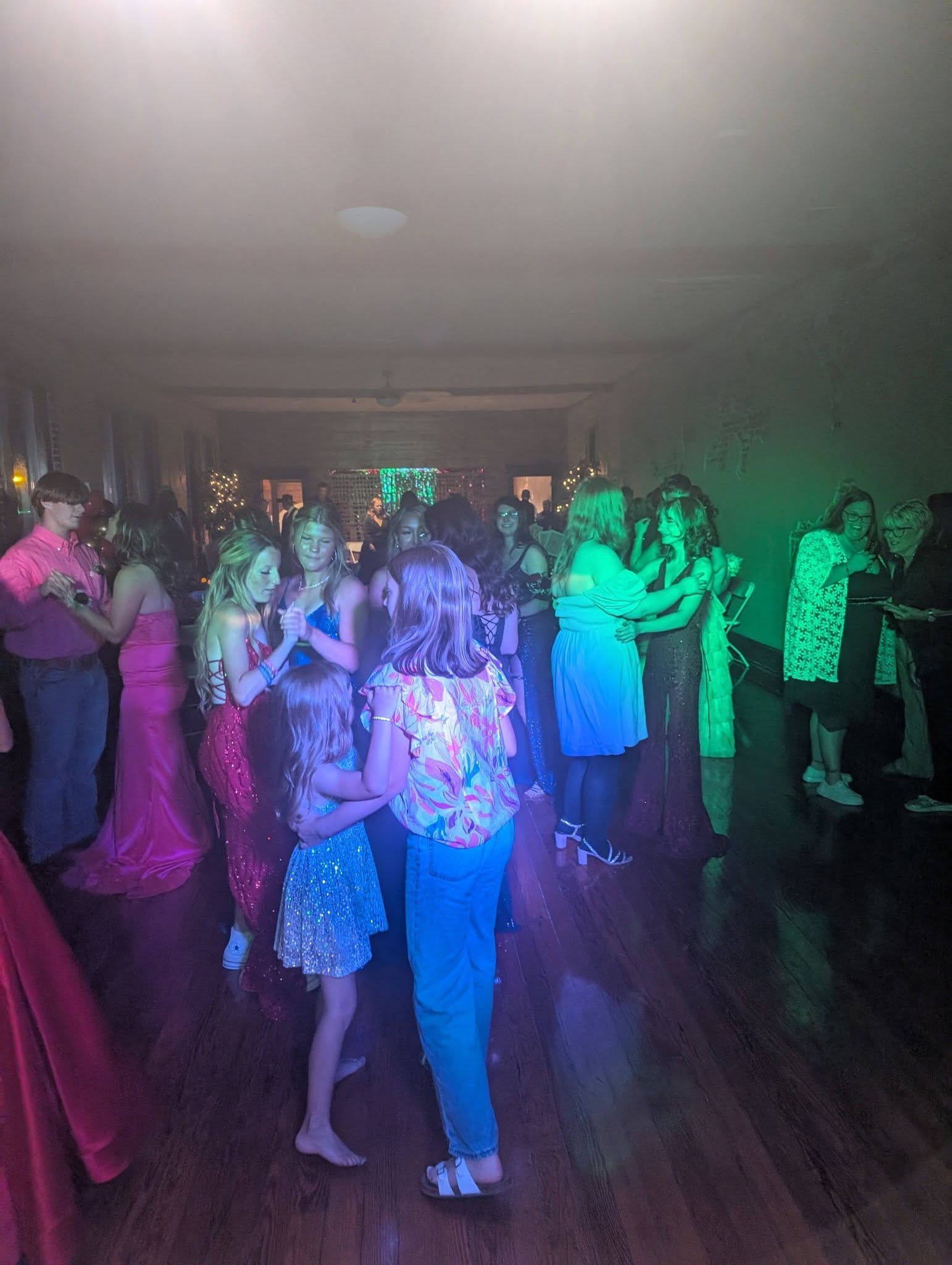 Crowd at DJ Wildman prom green/purple lights