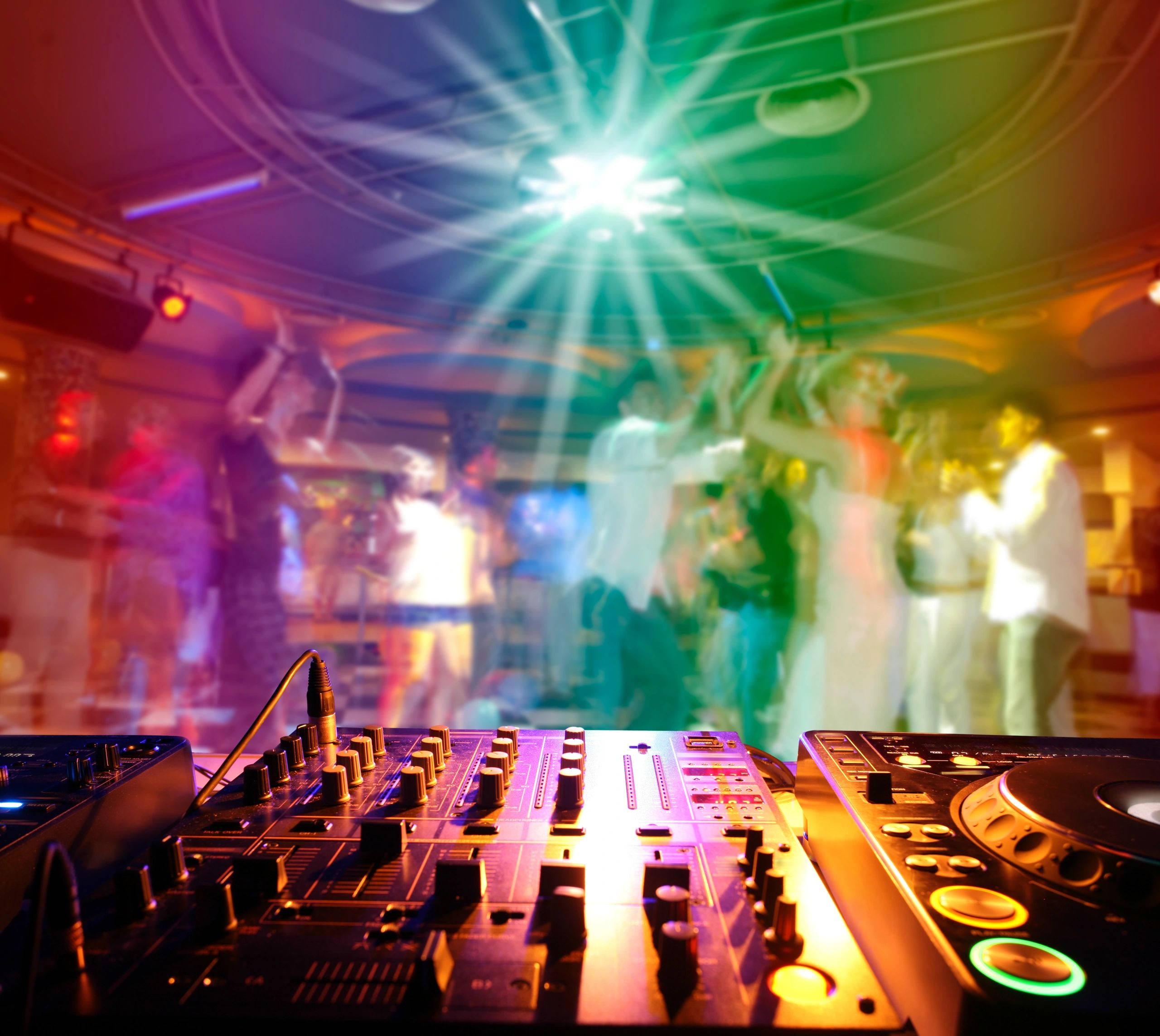 DJ Wildman at the booth with laser lights