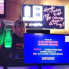 DJ Wildman performing live with laser lights and full production setup